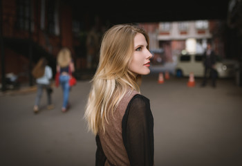 Outdoors portrait of beautiful young woman. Selective focus.