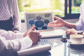 close up of businessman show business plan from computer laptop in business meeting.