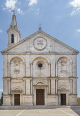 Fototapeta na wymiar The stunning facade of the Duomo di Santa Maria Assunta cathedral, in the historic center of Pienza, Siena, Italy on a sunny day