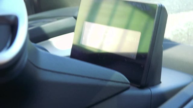 Closeup on a digital speedometer in a car in motion