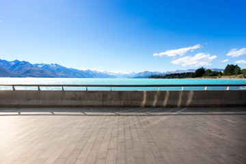 empty floor with beautiful lake in blue sky