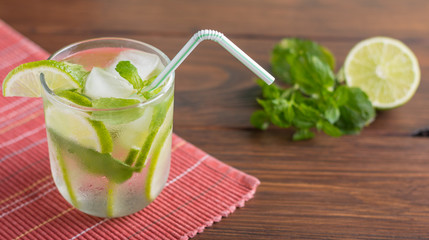 cocktail on a napkin with a straw