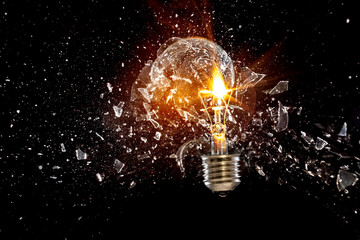 Explosion bulb vintage glass flame black background. energy crisis, creativity