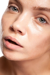 Fototapeta premium Beautiful woman with wet face. Studio photo. Beauty and skin care