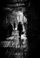 Marrakech man walking in shadow
