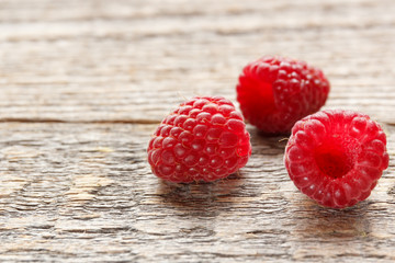 Fresh and sweet raspberries background. Selective focus