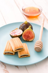 Fig cookies on white wooden table
