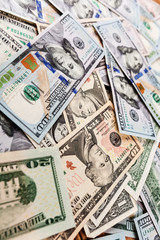 a purse with the American dollars is isolated on a wooden background