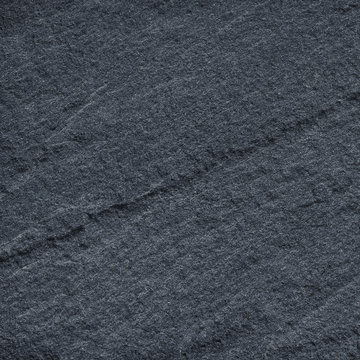 Dark grey black stone slate background or texture