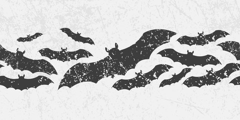 Vector seamless Halloween border with scary symbols -  black bats. Grunge style, shabby imitation. - 169810239