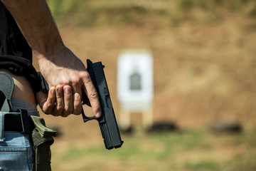 The man hid the gun behind their backs, robbery, crime, kidnapping