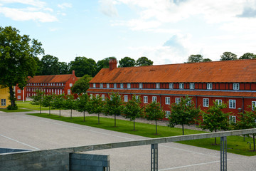 Fototapeta na wymiar The Copenhagen Citadel (Kastellet), old red buildings in European city