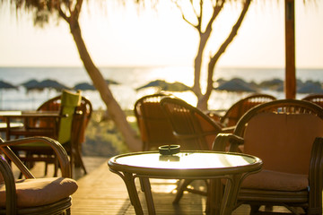 Outdoor cafes in coastline resort Kamari in Santorini Greece