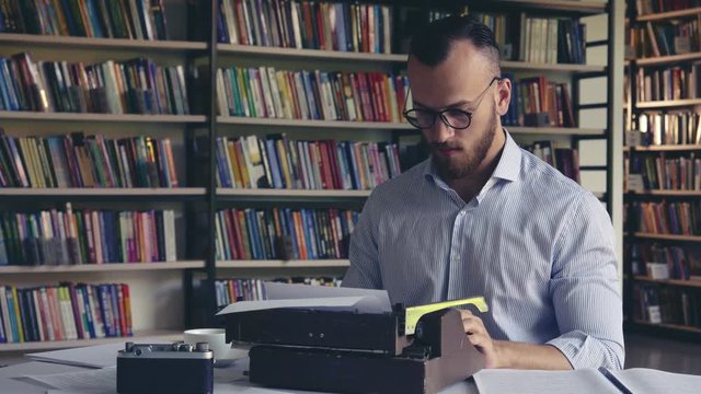 Young author prints on a typewrite