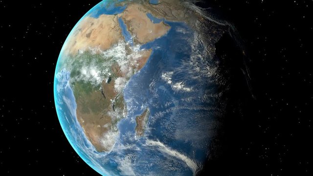 Night to day - rotating Earth. Zoom in on Tanzania outlined
