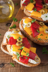 italian bruschetta with roasted peppers goat cheese olives