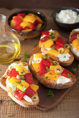 italian bruschetta with roasted peppers goat cheese olives