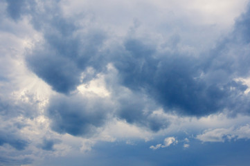 Fototapeta premium Blue fluffy storm clouds in the blue sky