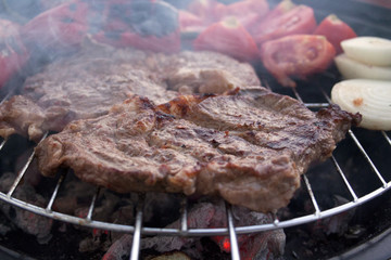 Grilling steak on bbq