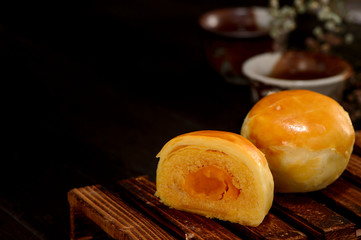 yolk pastry(Egg yolk shortcake) on wooden table isolated on black backgrond