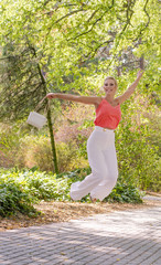 Beautiful young woman posing in park. Outdoor portrait photography.