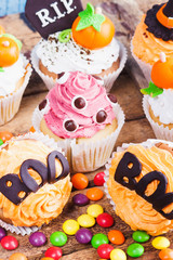 Halloween cupcakes with colored decorations
