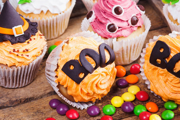 Halloween cupcakes with colored decorations