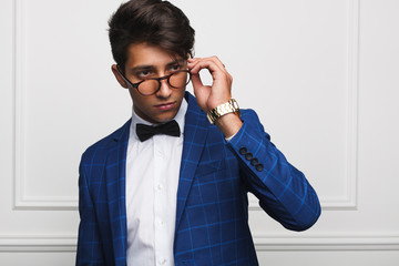 Confident stylish dandy in glasses