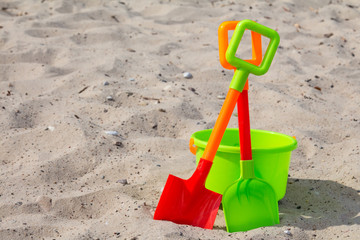 Fototapeta na wymiar Shovels and bucket on the beach