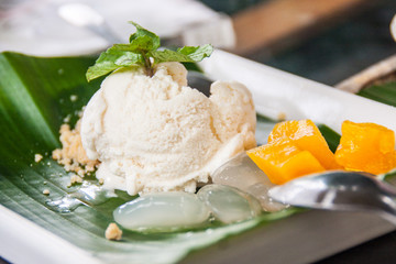 Coconut Ice Cream / Fresh Coconut Ice Cream Is Placed On Green Banana Leaves In A White Dish.