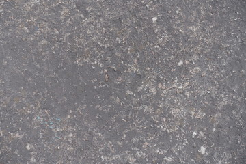 Surface of dark grey concrete slab from above