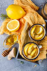 Cups of ginger tea with honey and lemon