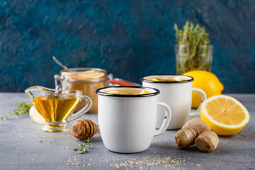 Cups of ginger tea with honey and lemon