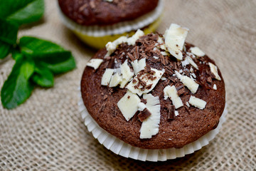 Closeup of Chocolate Muffins on a Rustic Burlap Sack.