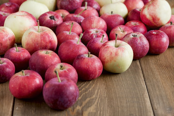 Background with small apples Wooden background Beautiful small apples Harvest background