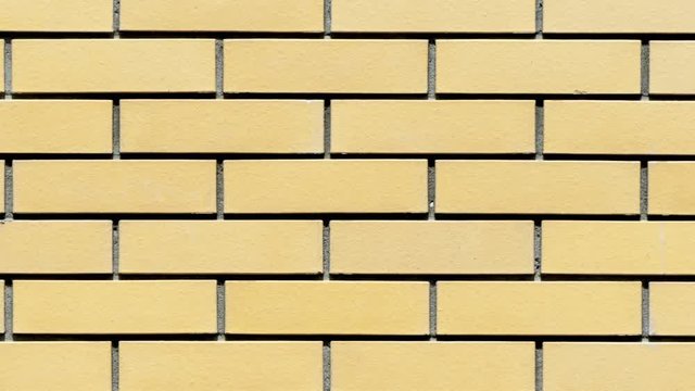 Yellow brick wall close-up background for sites with zoom effect