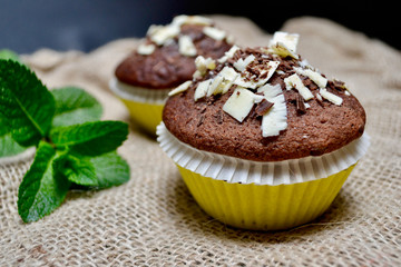 Closeup of Chocolate Muffins on a Rustic Burlap Sack.