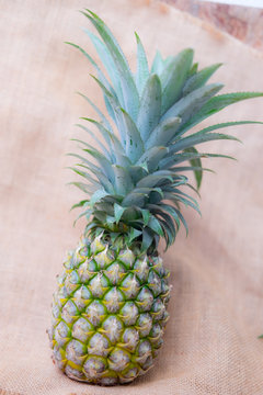 Pineapple with green leaves.