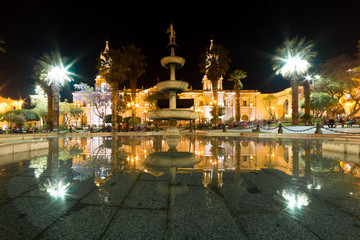 Plaza de Armas reflections at night