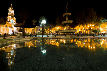 Fototapeta na wymiar Plaza de Armas reflections at night