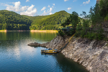 Amazing mountain lake Vidraru in Carpathian mountains at Romania, wild nature landscape in the summer