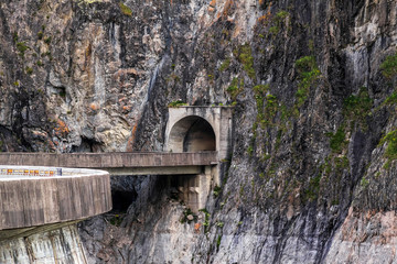 Transfagarasan road with tunnel entrance at the rocky Fagaras mountains, Romania
