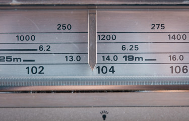 Vintage radio tuning dial, strong differential focus. Styled photo