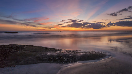 Fototapeta na wymiar seascape in sunset with rock 
