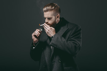 stylish man smoking cigarette © LIGHTFIELD STUDIOS
