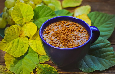 Autumn leaves. Coffee with grated chocolate.