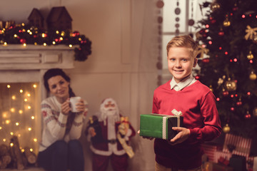 little boy with christmas present