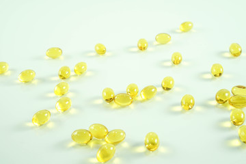 Fish oil capsule, yellow soft gels capsules, Yellow oil pills on white background