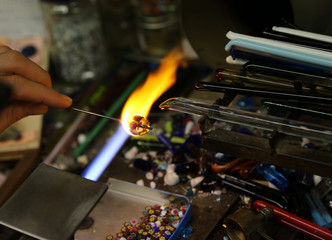 Warm flame used by the vetraio artist while modeling the glass i