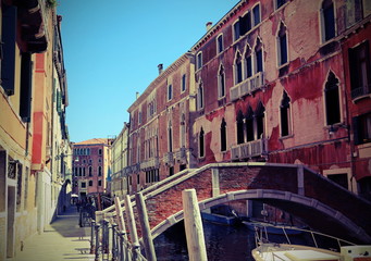 View of the old houses of Venice and a brick bridge